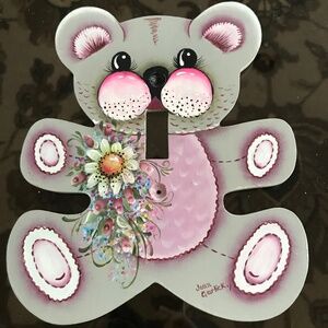 A lovely hand painted baby light switch cover.